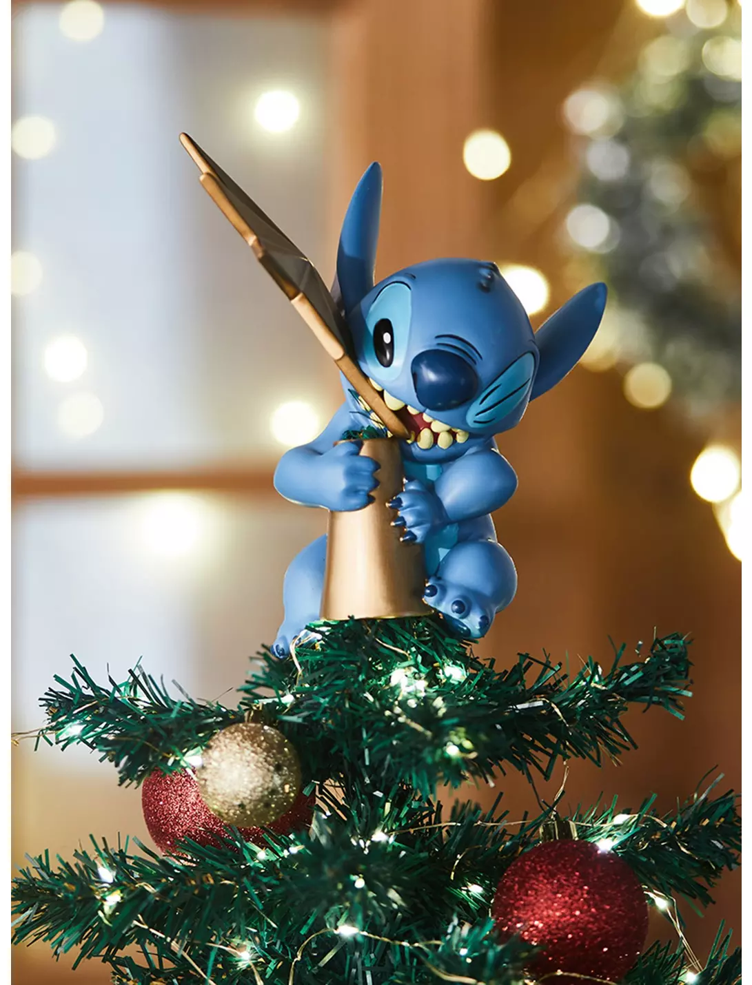 Take A Bite Out of Christmas With This Stitch Tree Topper