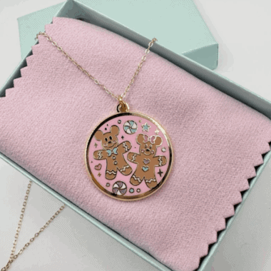 Colorful gingerbread bear pendant jewelry for Disney fans.