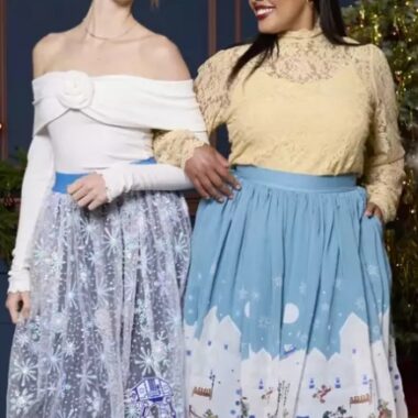 Elegant Disney holiday fashion featuring festive winter skirts with snowflake and Christmas village designs. Perfect for holiday parties and themed celebrations.
