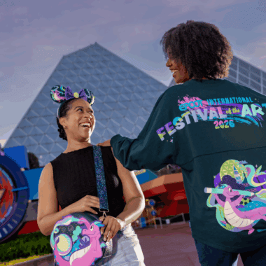 Colorful Disney festival apparel with a girl wearing Mickey Mouse ears and a women in Festival of the Arts jacket in front of EPCOT.