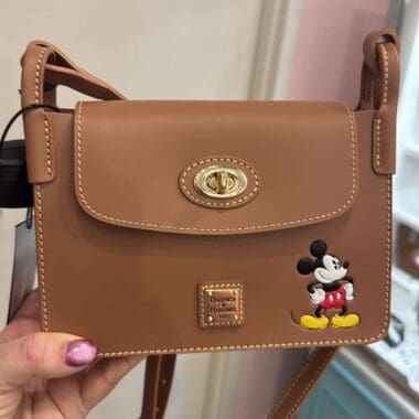 Mickey Mouse purse featuring Disney branding, leather material, and classic design for Disney fashion fans.