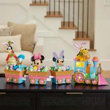 Colorful Disney Easter train with Mickey, Minnie, Goofy, and Pluto characters, perfect for Disney holiday décor.