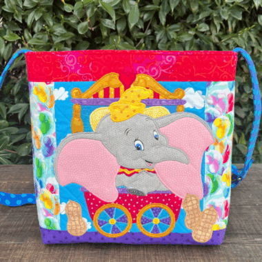 Colorful Disney-themed embroidered elephant tote with vibrant patterns and playful design.