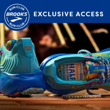 Bright blue Disney RunDisney shoes with commemorative Disneyland 70th anniversary logo, perfect for Disney marathon events.