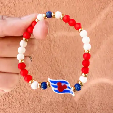 Bright red, white, and blue Disney-themed beaded bracelet with Mickey Mouse charm.