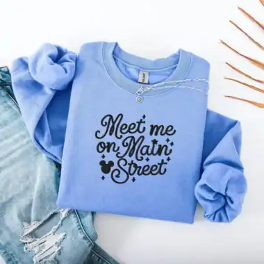 Bright blue crewneck with playful typography and Mickey mouse icon, ideal for casual wear.