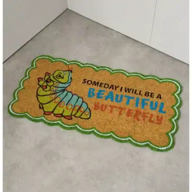 Brightly colored caterpillar-themed doormat with inspiring quote.