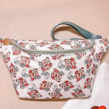 Mickey Mouse themed tote bag with colorful print and light blue handle.