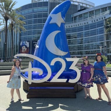 D23 Expo entrance sign with Disney characters outside the Convention Center.