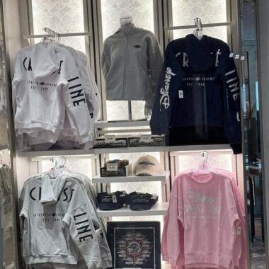 Disney-themed casual wear including hoodies and sweatshirts on display.
