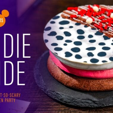Decorative Halloween cookies with red, white, and black icing for Disney Halloween party.