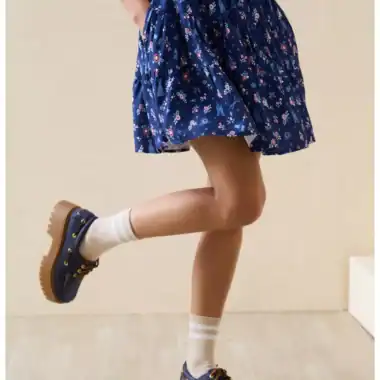Blue floral skirt styled for Disney fashion enthusiasts.