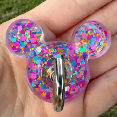 Colorful glitter Mickey Mouse shaped keychain for Disney fans.