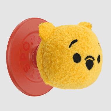 Winnie the Pooh plush PopSocket with a red base for phone grip.