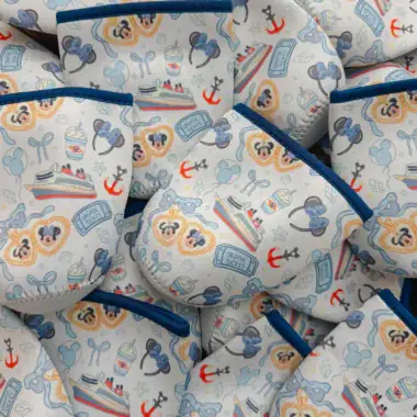 Colorful Disney Cruise Line-themed cup covers with nautical and Disney characters.